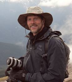 Buff with his photo gear deep in the North Cascades